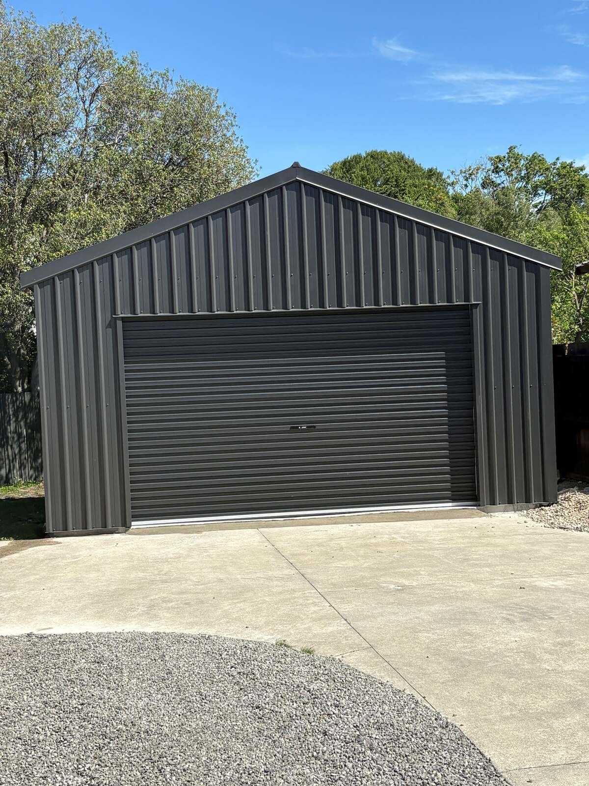Charcoal 6.2 x 5.2 kitset garage, front three-quarter view